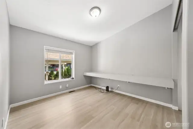 3rd bedroom with built in media shelves. Previously used as a gaming center. Could make a great guest room and office space.