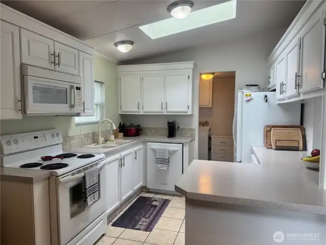 The kitchen features ceramic tile flooring.