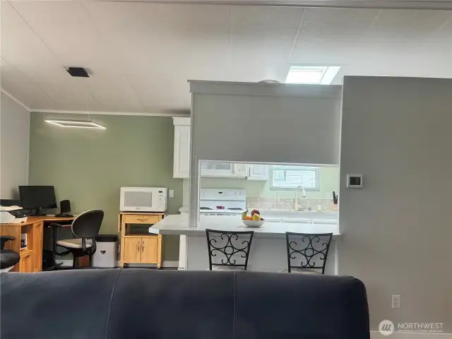 The kitchen and dining room/office, as seen from the living room.