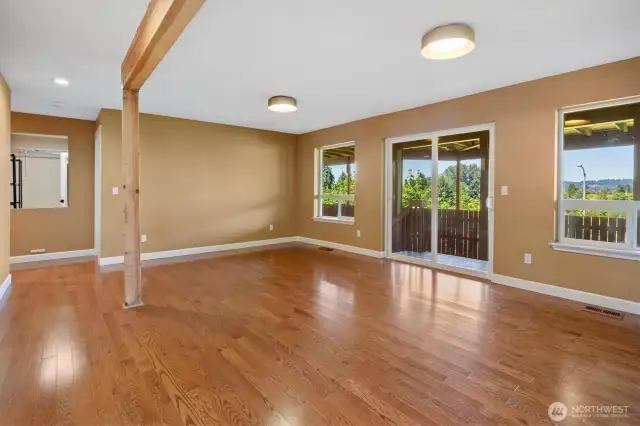 Versatile lower-level living room with perfect for movie nights, game days, or a guest retreat—seamlessly opens to the lower deck for easy indoor-outdoor living.