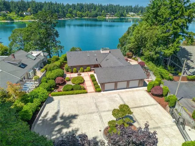 Gated entry on a dead end street for privacy.  Large parking area for gatherings & toys that reside outside of your three car garage.  Extensive hardscape defines mature trees & landscape.   The attention to detail & immaculate care of the home impress as you appreciate the well planned layout.