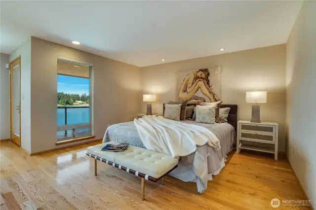 Primary suite with room for a sitting area, 5 piece bath, 2 walk in closets & access to the covered outside veranda.