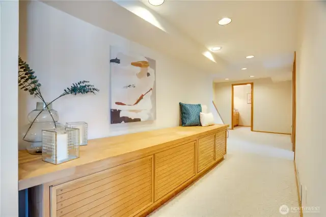 Lower level hallway with built in storage bench.