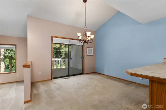 Dining space with slider to back deck