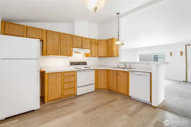 The open floor plan allows for a roomy kitchen, and it comes with all these appliances you see here!