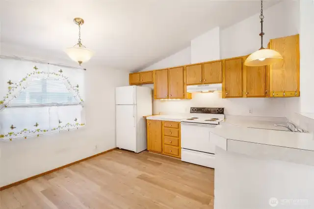 The kitchen is roomy enough for a table and chairs. The refrigerator space can hold an even larger refrigerator if you'd like!