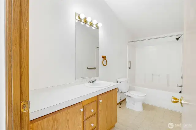 Don't ya love lots of counter space in a primary full bathroom? And room for extra cabinets if you choose.