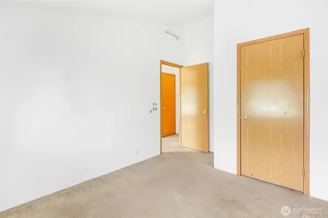 Third bedroom can function as a nursery, craft room, or another sleeping space. It includes carpeting, a window for natural light, standard closet storage, and flexible space for your needs.
