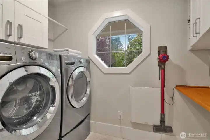 Designed for efficiency—keep chores simple in this practical utility room on the main level