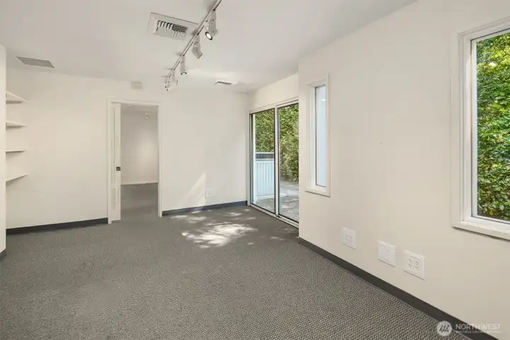 Additional flex room with sliding glass door entry