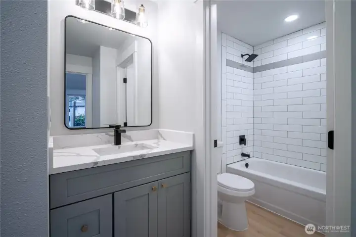 First of two bathrooms, with heated mirrors and designer fixtures
