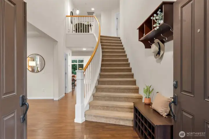 Soaring ceilings, natural light, and french doors! Beautiful laminate hardwoods throughout most of main level.