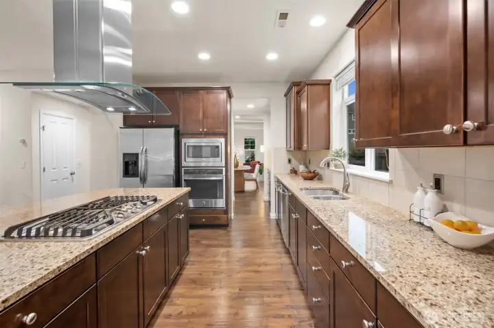 This kitchen is a dream for cooking and baking! So much counterspace, gas cooking, storage, and a pantry.