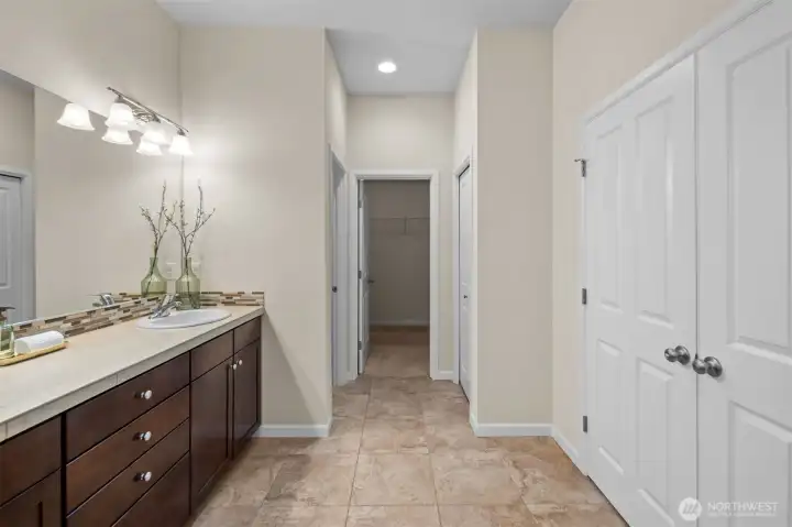The primary suite bath includes a linen closet!