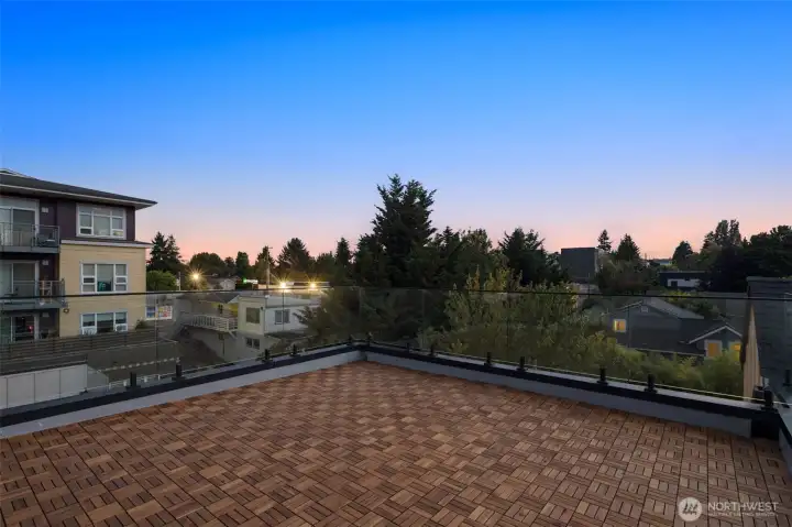 Rooftop deck with views stretching across Greenwood, perfect for sunset happy hours.