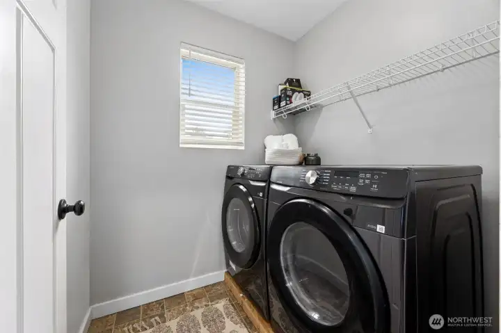 Utility room conveniently located on upper level.