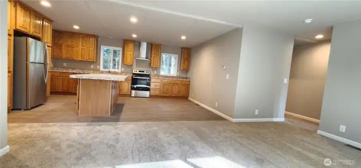 Large open area with breakfast bar / island.