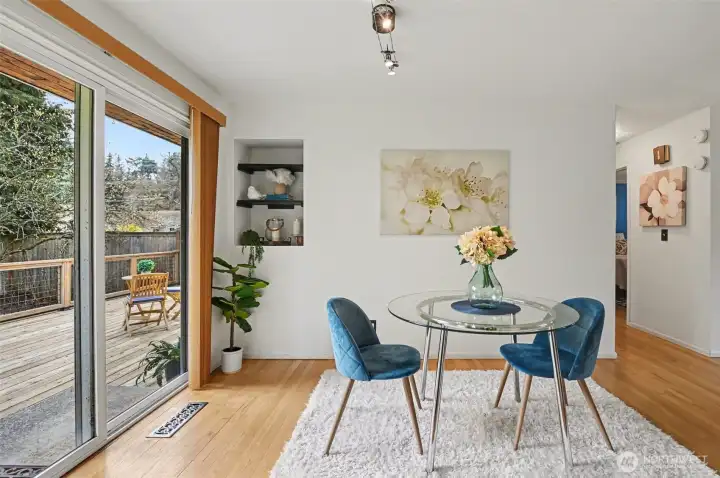Delightful dining area with access to the entertainment-sized deck & private fully-fenced yard.