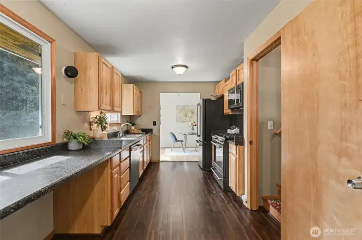 Spacious chef's kitchen with plenty of counter-space adjacent to the upper bedroom or office.