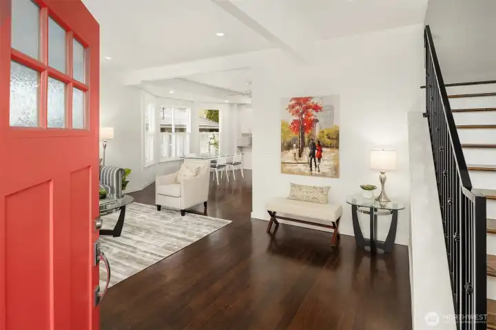 Step inside this renovated 1907 Craftsman to discover original fir hardwood floors, tall ceilings, large bay windows, and an inviting open living/dining room layout ideal for both everyday living and entertaining.