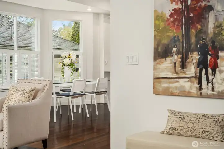 Step inside this renovated 1907 Craftsman to discover original fir hardwood floors, tall ceilings, large bay windows, and an inviting open living/dining room layout ideal for both everyday living and entertaining.