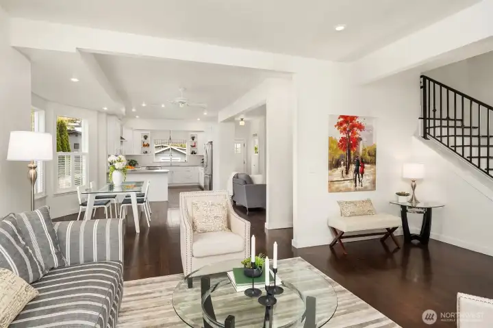 Step inside this renovated 1907 Craftsman to discover original fir hardwood floors, tall ceilings, large bay windows, and an inviting open living/dining room layout ideal for both everyday living and entertaining.