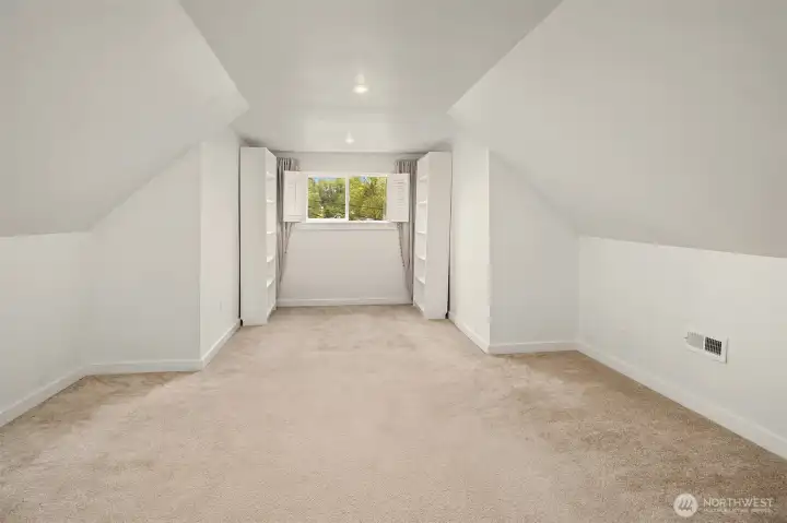 The top floor provides another bedroom with good ceiling height, and 5 closets in the bedroom and the stair landing.  Custom closets throughout provide extensive storage space.