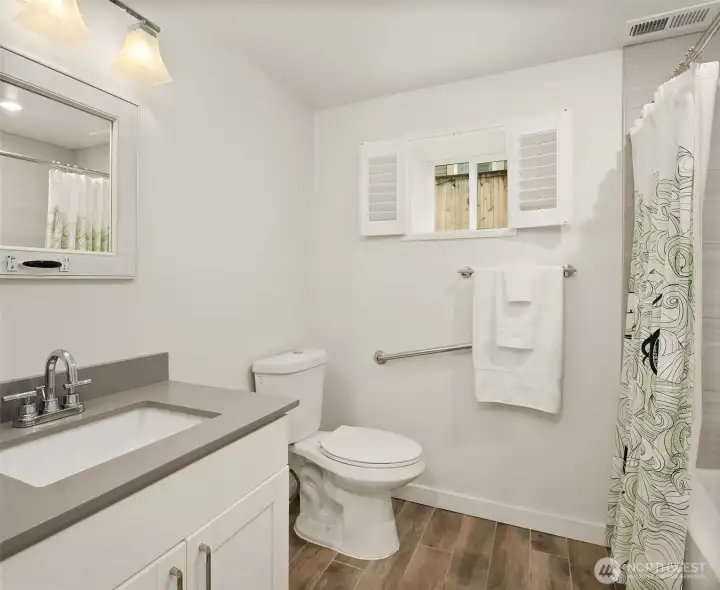 The daylight basement features tall ceilings, media room & two guest bedrooms framing a full bath.