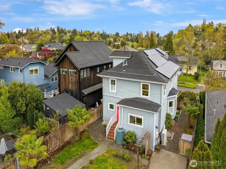 Two off-street parking spots. EV car charger line (2022).