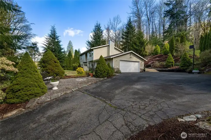 Set back from a paved and dead end street with ample parking and outdoor space