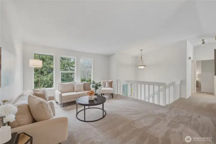 The formal living room looks over the front of the home with large windows