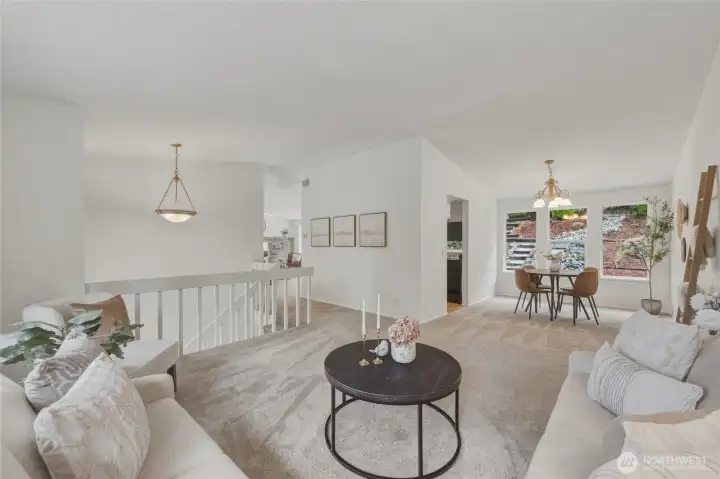 The living room connects to the dining area that overlooks the beautiful backyard