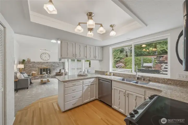 The kitchen sits between the dining room and family room