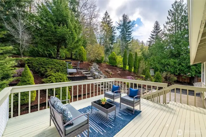 This back deck is massive and great for enjoying the sunshine and gardens