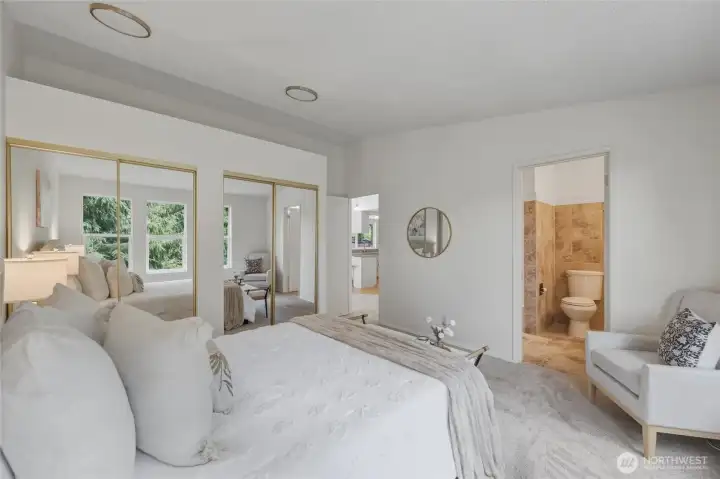 The primary bedroom directly connects to the bathroom, also accessible from the hallway