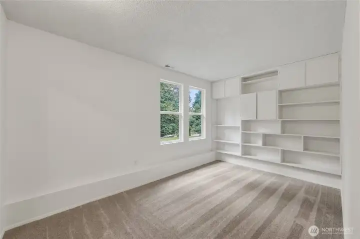 The other lower bedroom, also with built in shelving.