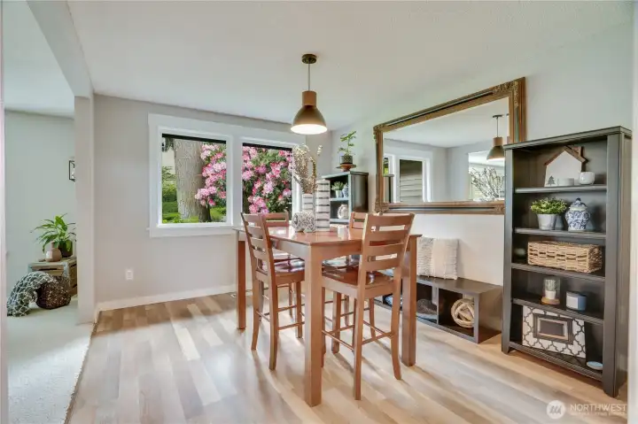 This sunny dining room flows into the kitchen for easy prep, serve, entertain and enjoy!