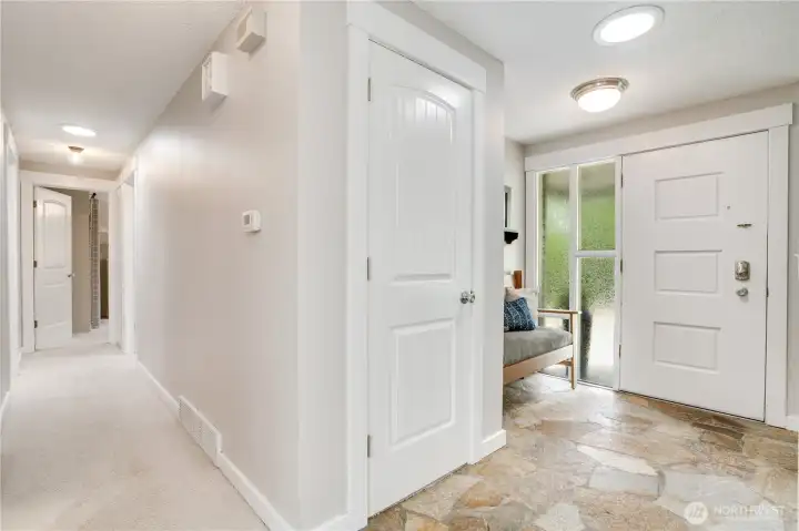 This warm and bright entry is the corridor to the upstairs bedroom suites.