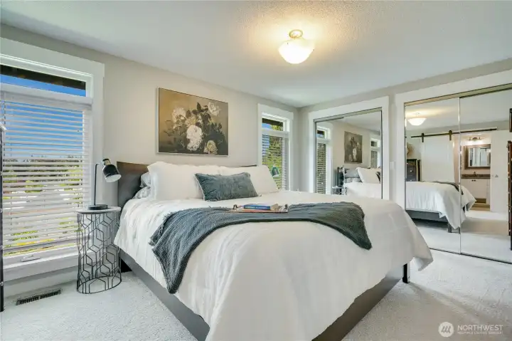 The owner's suite has dual closets; a remodeled spa-like bath with custom tile shower and plenty of space.