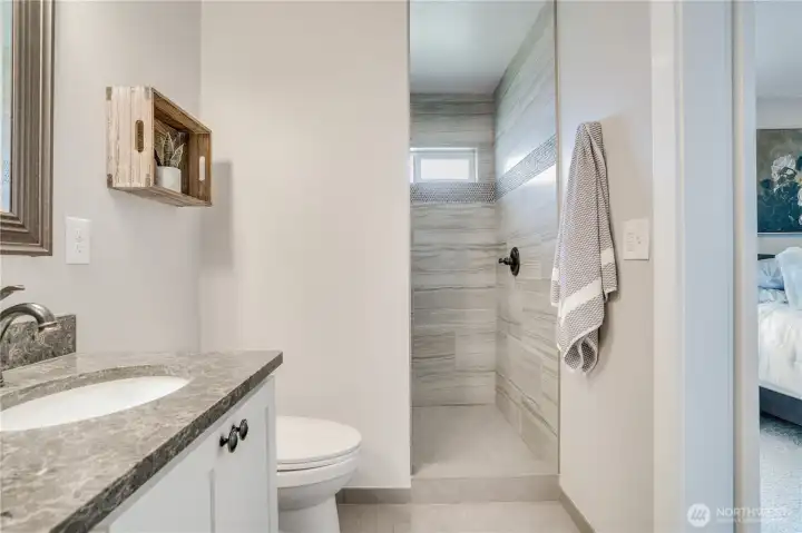 Spa-like bathroom with heated tile flooring make even a chilly AM seem cozy.