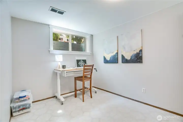 This HUGE utility room has craft space, a second fridge and a freezer.  This makes the lower level the perfect place to entertain - or cozy up with projects and Netflix.