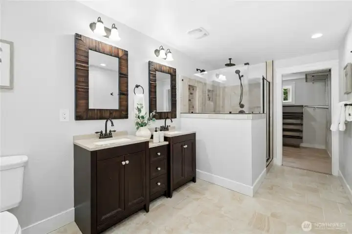 Primary ensuite bathroom with walk-in closet