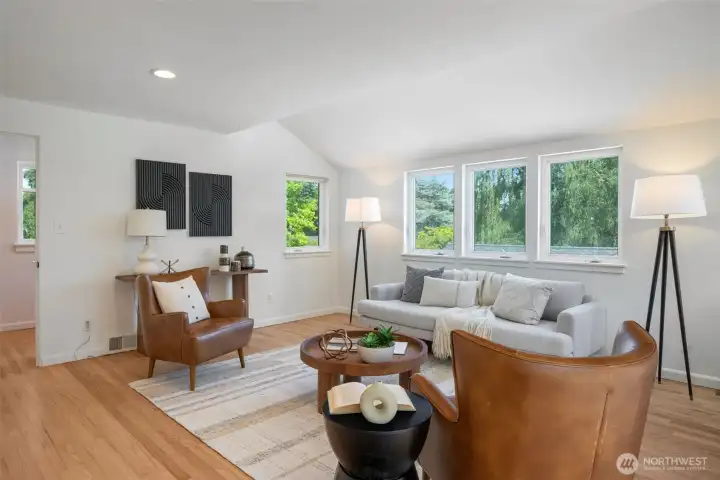 Cozy living room with vaulted ceilings and track lighting. Cozy living room with vaulted ceilings and track lighting.