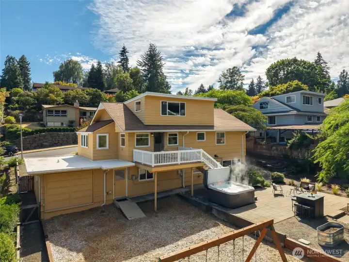View of back of the home including garage door allowing easy access to the backyard. View of back of the home including garage door allowing easy access to the backyard.