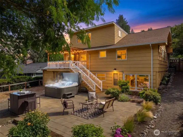 Relax year-round in the immaculately maintained hot tub or host gatherings on the expansive entertainment patio. Relax year-round in the immaculately maintained hot tub or host gatherings on the expansive entertainment patio.