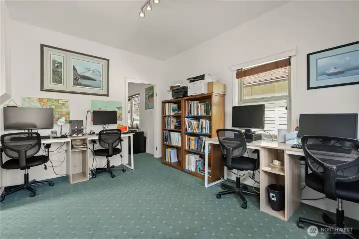 Spacious office area with room for multiple workstations and collaborative workspace needs.