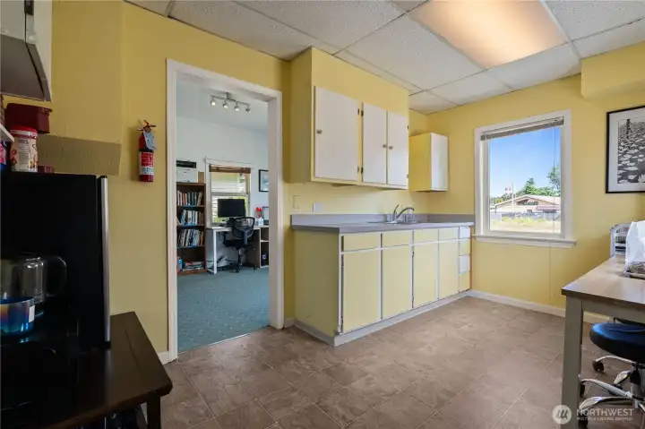 Kitchenette and break area providing convenience for employees, clients, or tenants.