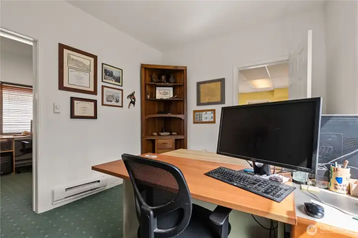 Private office space with built-in workstation and connectivity to adjoining work areas.