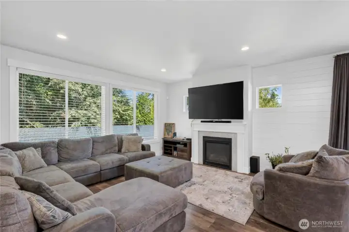 Cozy gas fireplace is focal point of living room.  Tons of windows to bring in natural light.