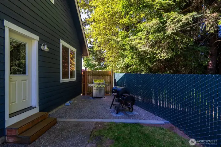 Smoker and bbq area (both will stay with home) with door into main living/kitchen area.